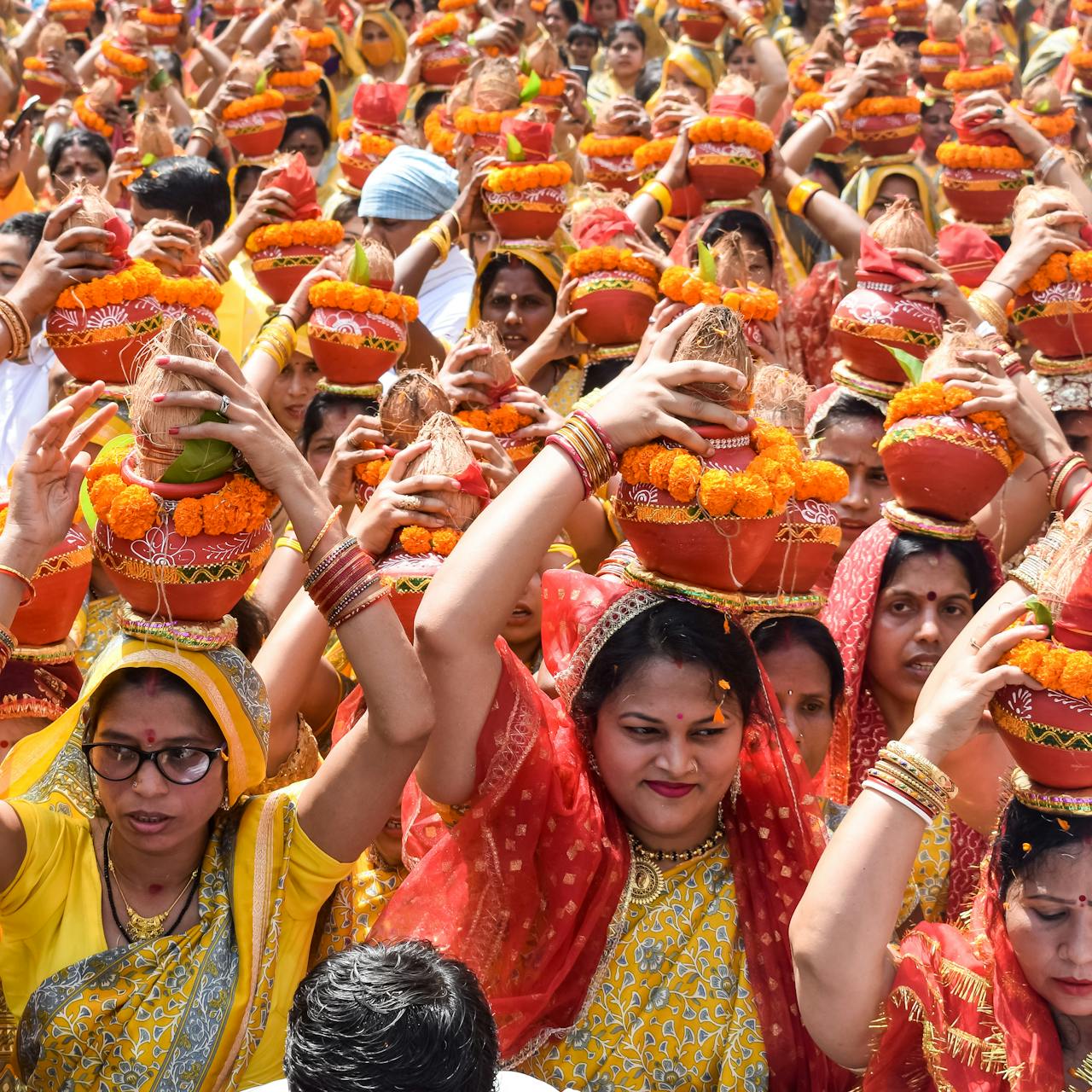 Mastering the First Impression: Your intriguing post title goes here Women in vibrant attire participate in the Mangal Kalash Yatra, a traditional Indian ceremony.