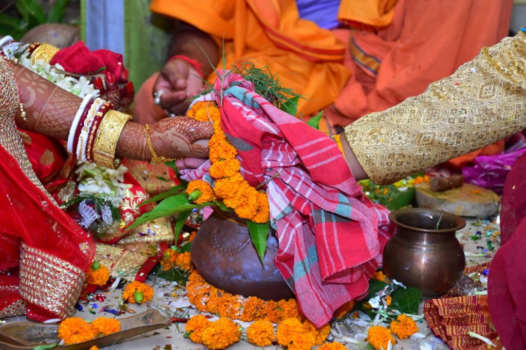 Colorful Indian wedding ceremony with intricate rituals and vibrant floral decorations.