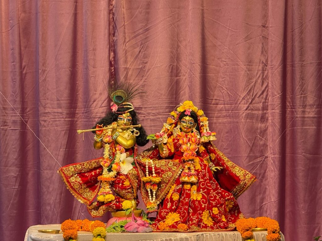 The Art of Drawing Readers In: Your attractive post title goes here Vibrant statues of Krishna and Radha in colorful attire with decorative floral elements indoors.