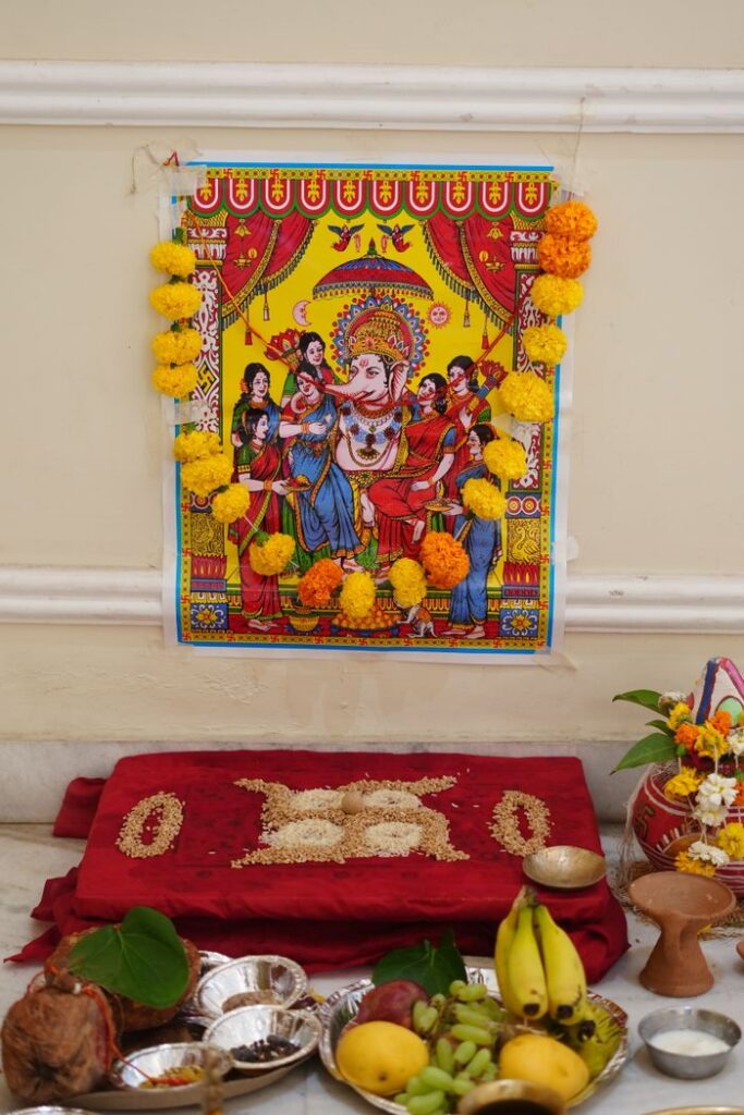 Vibrant display of a Ganesh Puja with traditional decor, fruits, and offerings.